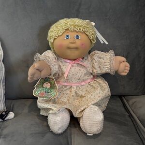 Vintage Cabbage Patch Doll with Floral Dress and Pink Accents